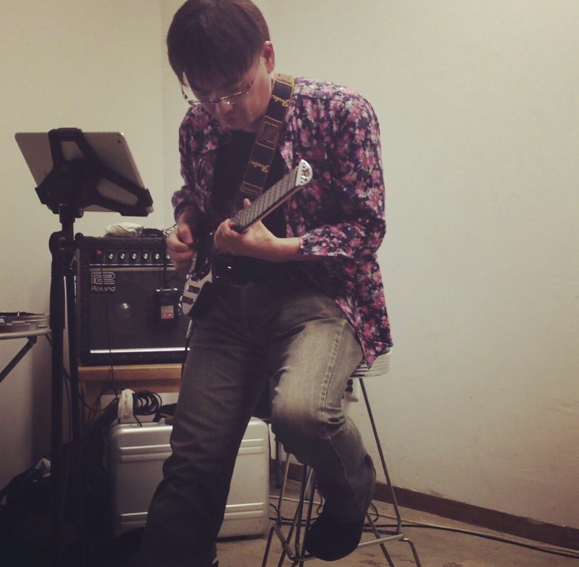 Yasuhiro Otani practicing guitar